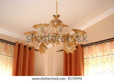 Luxurious brown chandelier in the living room.