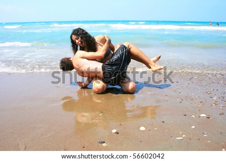 stock photo Teens having fun on the beach