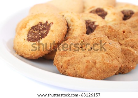 Cookies on plate on white background.