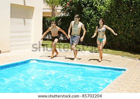 People jumping to swimming pool.