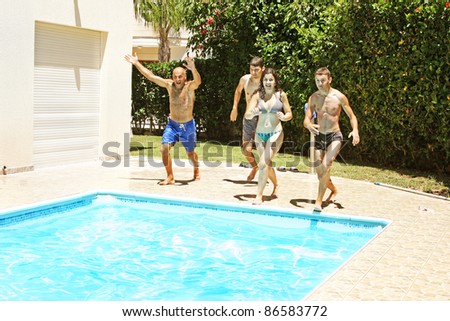 People jumping to swimming pool.