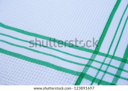 Texture of white and green cotton fabric as abstract background.