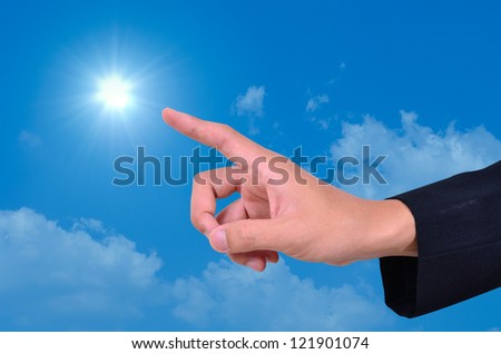 Businessman hand finger sky and sun showing freedom and green energy concept