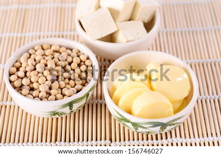 Fresh tofu and soybean product on bamboo background