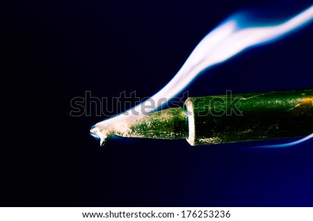 Close up Hot soldering iron with smoke