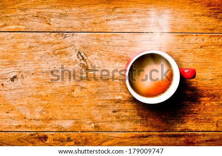 ed cup coffee on wood background for presentation and design