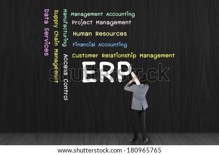 Business man writing Enterprise resource planning (ERP)