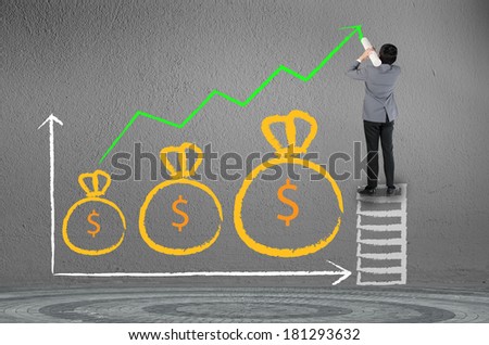 Business man drawing growing green graph with money bag symbol