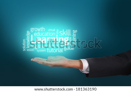 Businessman hand holding learning text wording in cloud concept