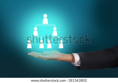 Businessman hand holding employee organization chart in human resources (HR) cloud concept
