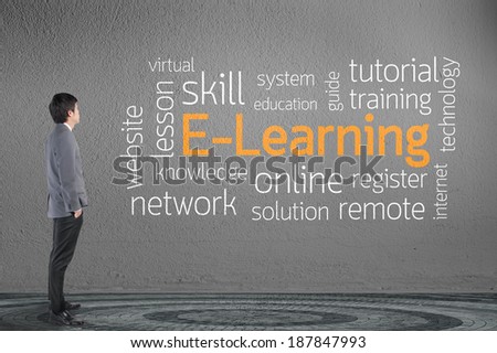 Businessman looking e - learning text wording in cloud concept