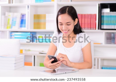 Asian student happy with online learning study by E-learning content technology with Mobile phone and Computer tablet