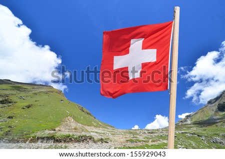 Swiss flag on beautiful mountain landscape