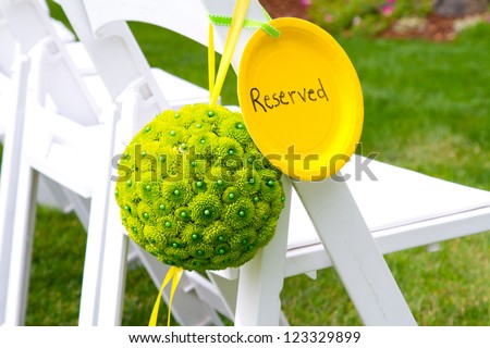 Flowers are placed together to create these unique green floral balls for wedding decor.