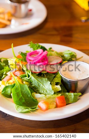 An image from a restaurant while dining out of a healthy salad that is low calorie and ready to eat.