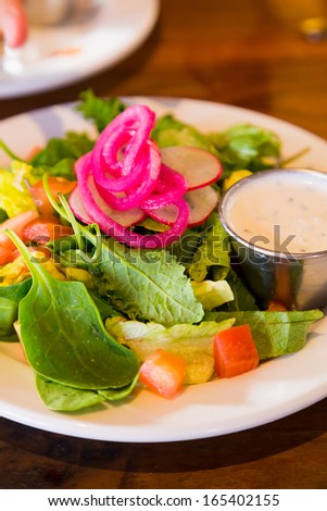 An image from a restaurant while dining out of a healthy salad that is low calorie and ready to eat.
