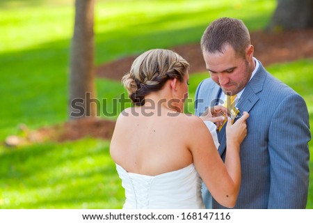 A bride and groom see each other for the first time on their wedding day and share a first look moment before the ceremony.