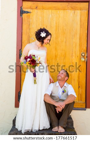 Portrait of the bride and groom on their wedding day in an alternative style ceremony.