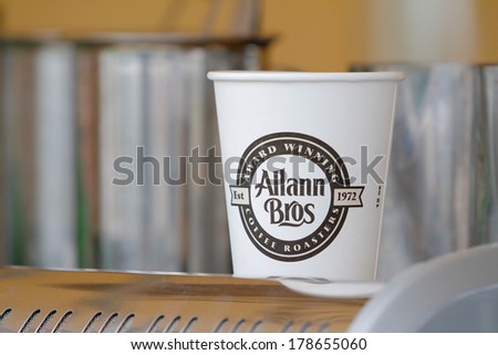 EUGENE, OR - APRIL 28, 2013: Allann Bros coffee cup with logo at a coffee stand during the 2013 Eugene Marathon.