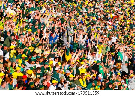 EUGENE, OR - OCTOBER 28, 2006: Autzen Stadium crowd does the wave while cheering on the Oregon Ducks during the UO vs PSU football game.