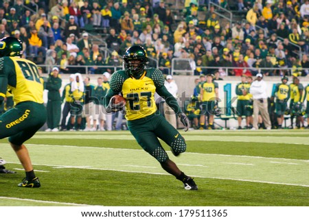 EUGENE, OR - OCTOBER 28, 2006: Oregon running back Andriel Brown carries the ball for a touchdown during the UO vs PSU football game at Autzen Stadium.