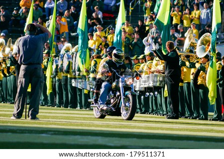 EUGENE, OR - OCTOBER 28, 2006: University of Oregon signature Harley Davidson motorcycle rides out of the tunner before the UO vs PSU game at Autzen Stadium.
