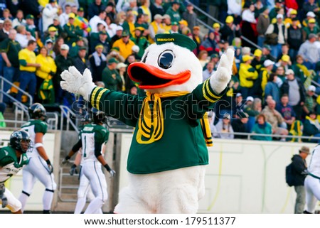EUGENE, OR - OCTOBER 28, 2006: Oregon duck mascot Puddles holds his arms wide to the crowd at the start of the UO vs PSU football game at Autzen Stadium.