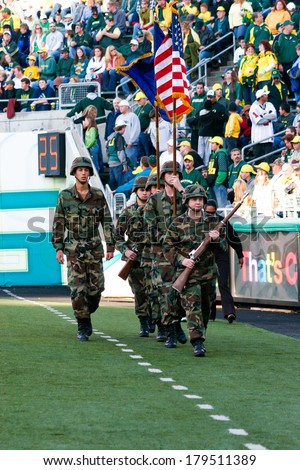EUGENE, OR - OCTOBER 28, 2006: Army soldiers bring out the flags for a University of Oregon football game versus Portland State at Autzen Stadium.