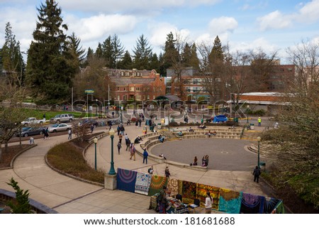 EUGENE, OR - MARCH 4, 2014: Busy campus with students walking to class on the University of Oregon campus in the winter.