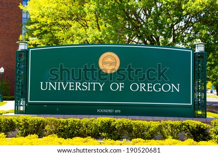 EUGENE, OR - APRIL 29, 2014: University of Oregon campus entrance sign next to a walkway at the school.