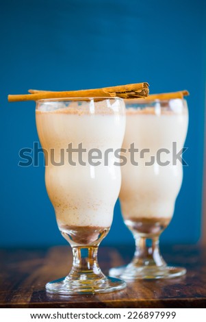 Mexican restaurant bar serving a traditional cinnamon horchata with cinnamons sticks.