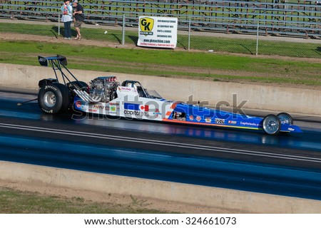 WOODBURN, OR - SEPTEMBER 27, 2015: Capitol Auto Group dragster racing at the NHRA 30th Annual Fall Classic at the Woodburn Dragstrip.