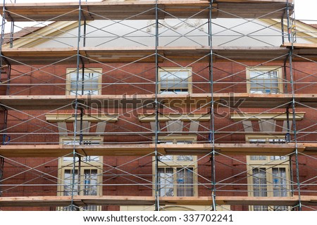 EUGENE, OR - OCTOBER 27, 2015: Gerlinger Hall on the University of Oregon campus undergoes major renovations and brick repair on the exterior of the building.
