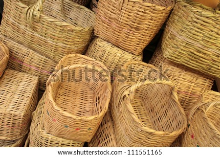A pile of handmade woven baskets for sale at the outdoor market in Otavalo, Ecuador