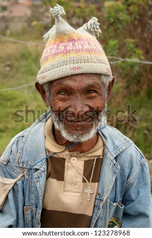 A homeless man in a knit hat on the street in Cotacachi, Ecuador