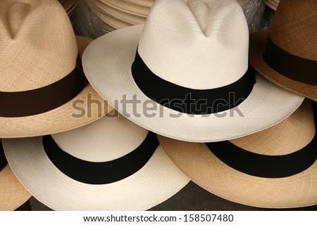Handmade Panama Hats Are Stacked For Sale At The Outdoor Craft Market In Otavalo, Ecuador