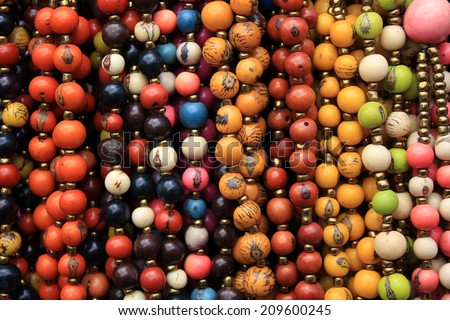 Colorful tagua nut beads for sale at the outdoor craft market in Otavalo, Ecuador