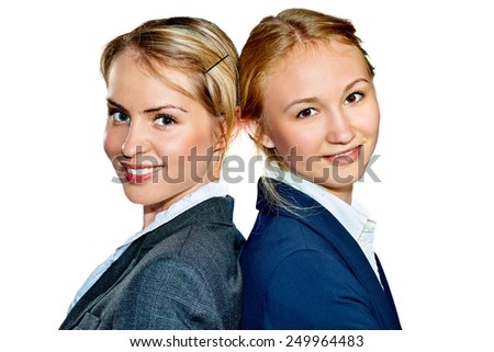 Close-up portraits of two girls standing back to back and smiling. Isolated on white background