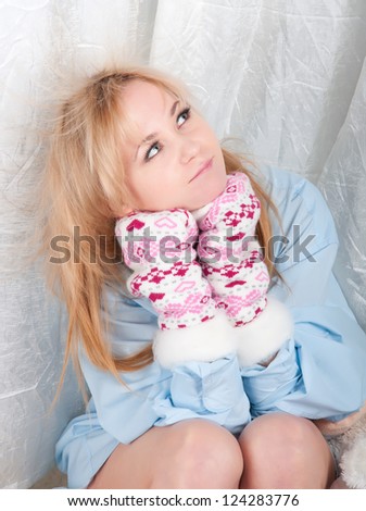 woman in man shirt with warm wool socks with hearts.
