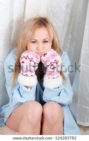 woman in man shirt with warm wool socks with hearts.