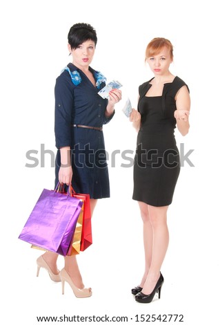 two smiling women with shopping bags holding money.