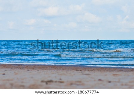 Clean sand beach and blue sky and sea.