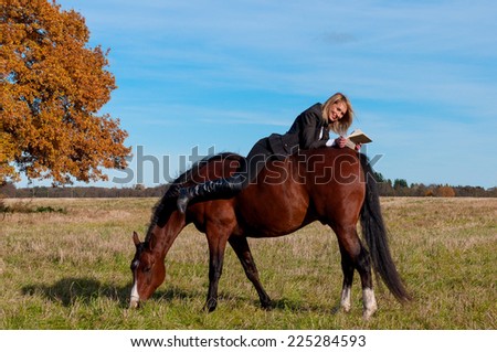 beautiful woman walking with horse and oak tree as background