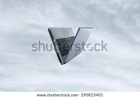 Open laptop  in different position on the sky background