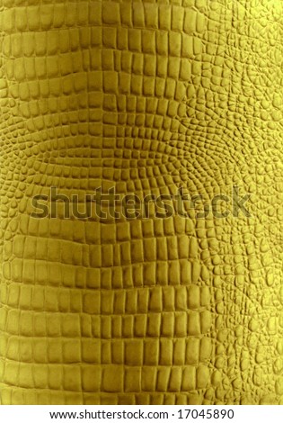 Golden reptile leather texture. Skin of golden reptile to backround