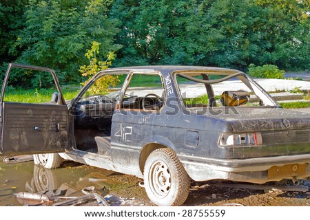 stock photo A old abandoned car to background
