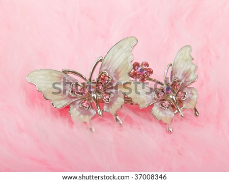 Original hair-pin butterfly isolated on pink down background