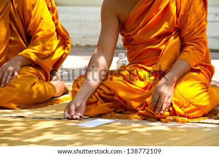 monks and religious rituals in thai temple