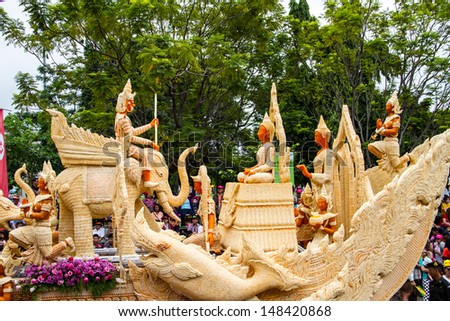 UBONRATCHATHANI, THAILAND - JULY 23: Candles are carved out of wax, Thai art form of wax(Ubon Candle Festival 2013) on July 23, 2013, UbonRatchathani, Thailand