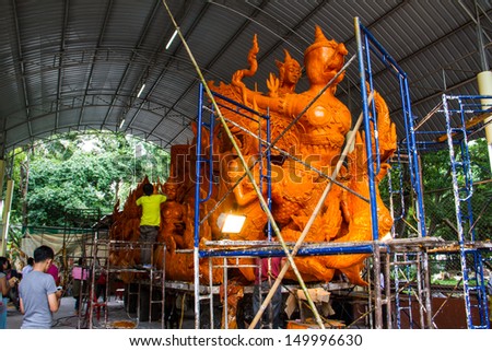 UBON RATCHATHANI, THAILAND - JULY 23: Candles are carved out of wax, Thai art form of wax(Ubon Candle Festival 2013) on July 23, 2013, Ubon Ratchathani, Thailand